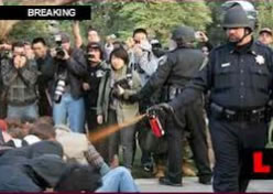 UC Davis Police Lt. John Pike spraying students with pepper spray